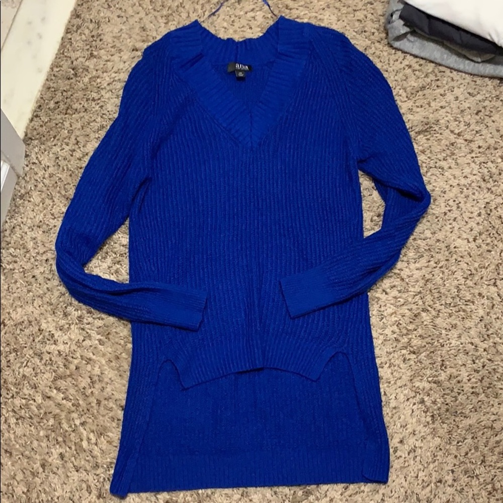 Blue sweater longer in back